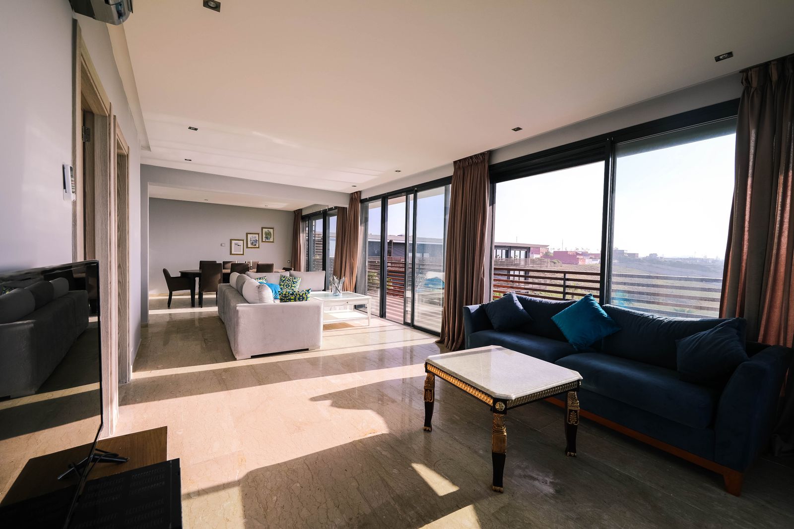 A bright, open-plan living room in an accessible apartment